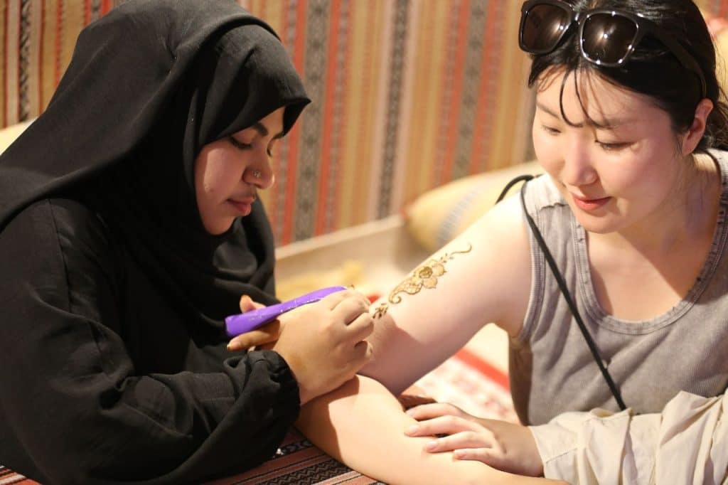 henna painting in safari adventures UAE