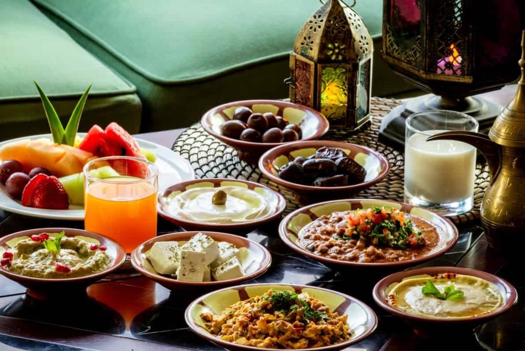 beautifully arranged table featuring traditional Ramadan dishes for Iftar and Suhoor